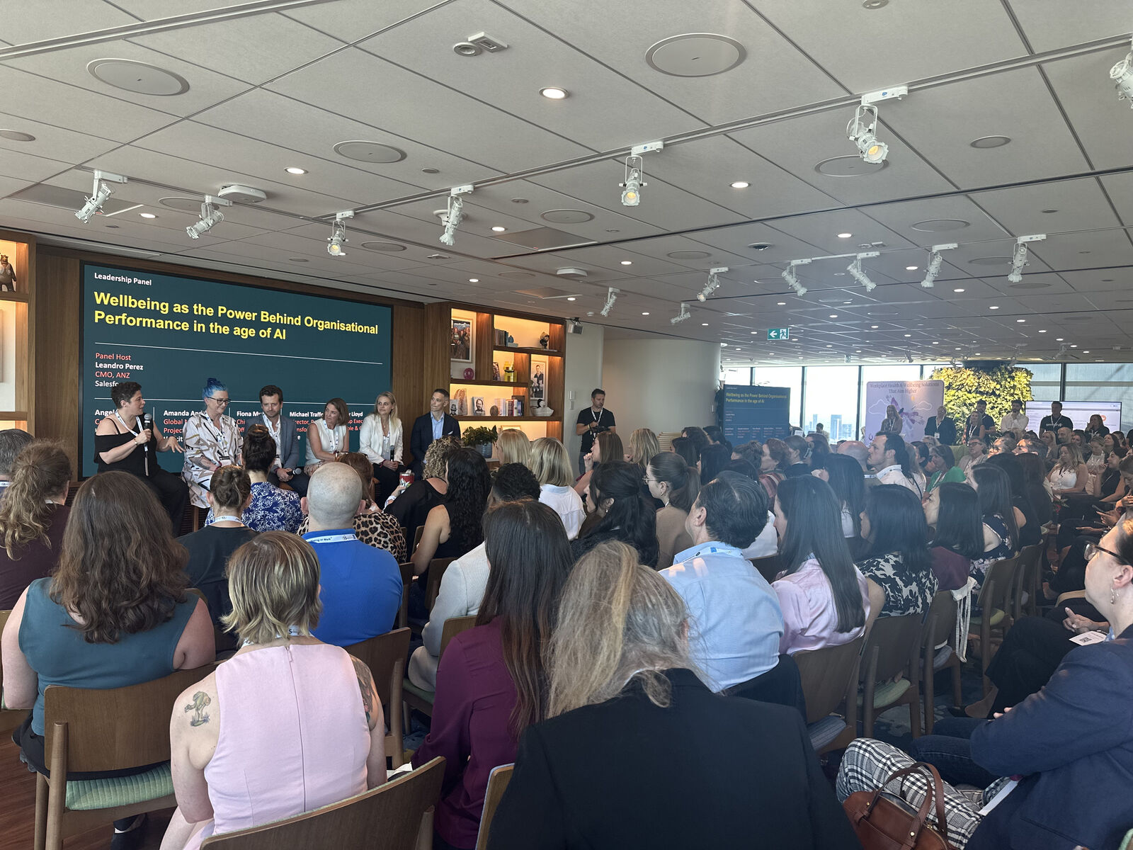 Amanda Anderson on the leadership panel at the Wellbeing at Work Summit 2025, with a full room